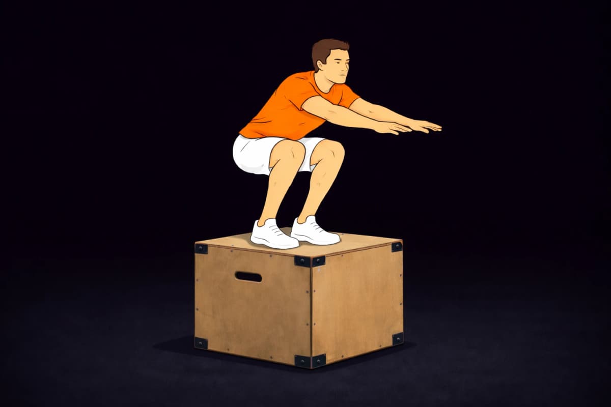 Athlete performing a box jump in a gym, landing in a squat position on a plyometric box.